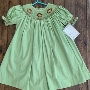 Smocked Bishop dress with wreath design. NWT